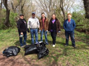 The volunteers who covered the Green Lane to the Lagoon section of Bristol Borough pose with the fruits of their labor. 