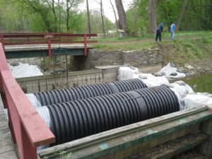 These pipes are allowing water to flow through the damaged Kleinhans Aqueduct. 