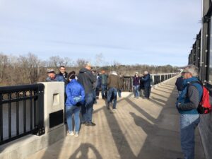 Pedestrians enjoy the view from a scenic overlook